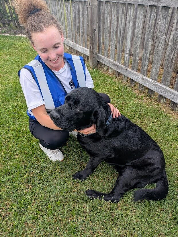 The Scoop Lab owner with a dog